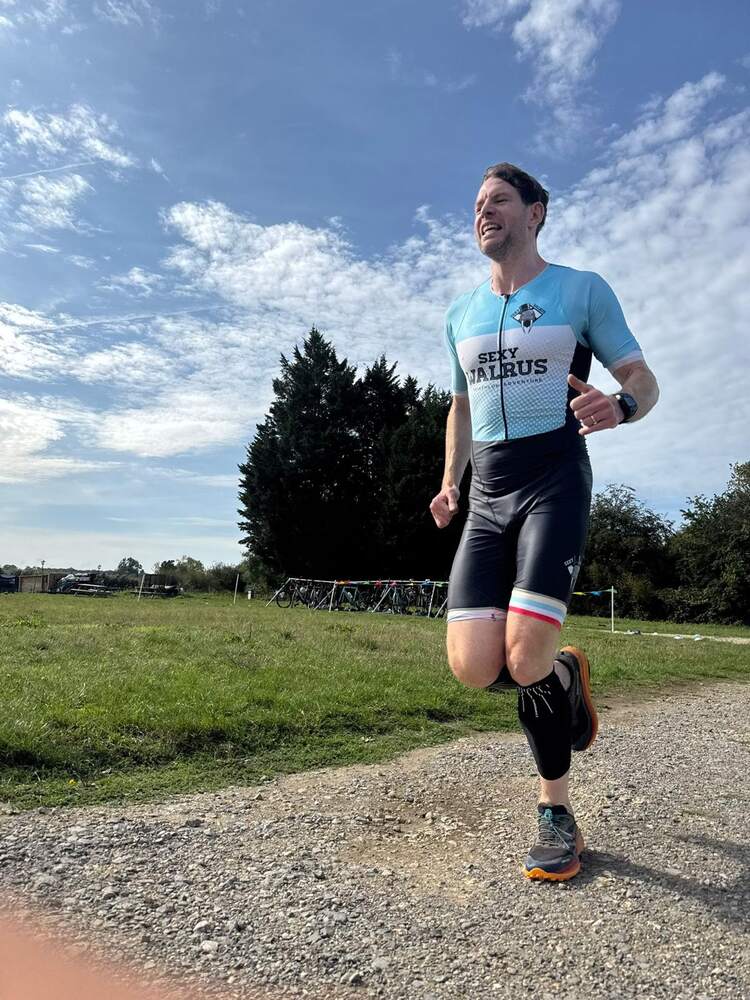 A member running on a gravel path
